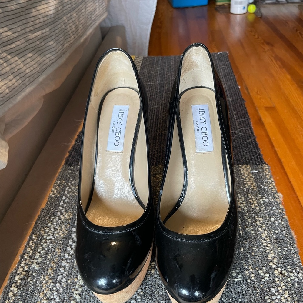 Jimmy Choo size 38 cork wedge color black worn one time. Open to a offer!